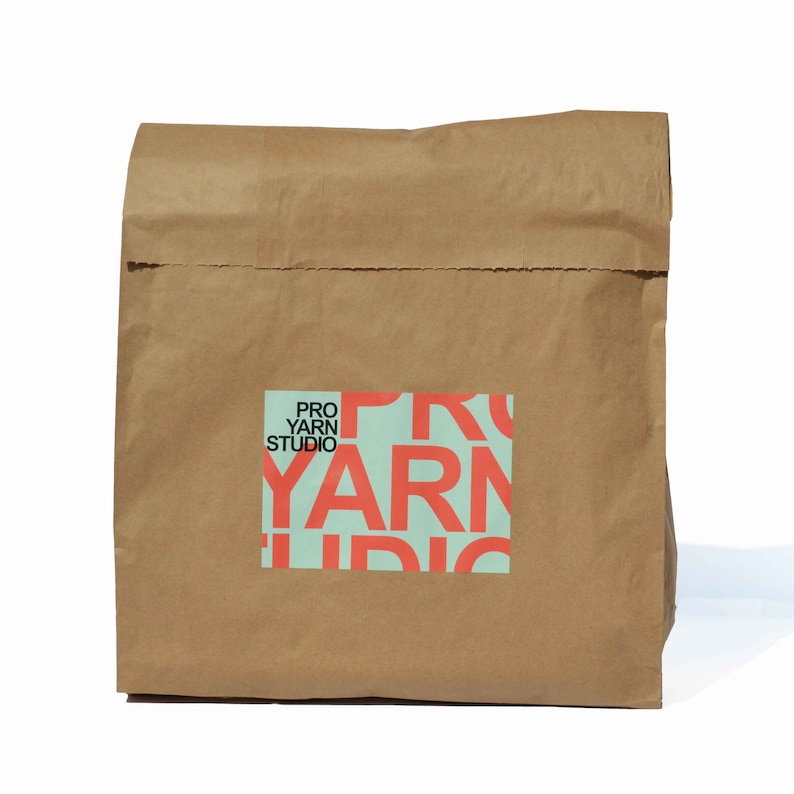 Paper sack that the learn to crochet blanket kit comes in.