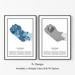 May include: Two framed wall art prints featuring maps of Ponta Delgada, Azores, Portugal. The left print displays a blue patterned mosaic map, while the right print shows a grey map with a heart shape. Both include text labels and descriptive paragraphs.