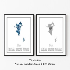 May include: Two framed wall art prints featuring maps of Bahrain. The left print displays a blue patterned map with a heart shape, while the right print shows a solid gray map with a dark gray heart. Both include text labels and descriptive paragraphs.