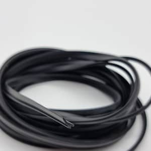 May include: Coiled black rubber weather stripping, ideal for sealing windows and doors. The flexible material is designed to create a tight seal, preventing drafts and moisture from entering. The weather stripping is shown against a white background.