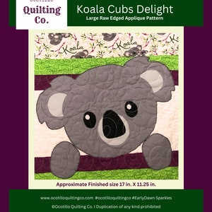 May include: Koala Cubs Delight quilt pattern featuring a gray koala bear applique with black eyes and a pink nose. The pattern is for a large raw edged applique and measures 17 inches by 11.25 inches when finished. The pattern is available on the website ocotilloquiltingco.com.