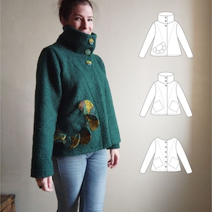 Peut inclure: Une veste verte à col montant et un design unique avec des accents de tissu colorés. La veste est portée par une personne.