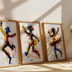 Puede incluir: Tres pinturas abstractas enmarcadas de bailarines en amarillo, rojo y azul con contornos negros. Los bailarines están en el aire con salpicaduras de pintura a su alrededor.