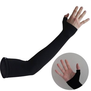 May include: Black arm sleeves with thumb holes. The sleeves are made of a stretchy, breathable material and are designed to protect your arms from the sun and wind.
