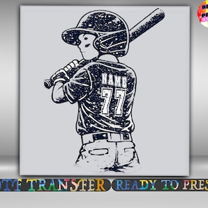 May include: Black and white illustration of a baseball player in a helmet, holding a bat. The player's jersey has the name "NAME" and the number "77" on the back. The image is a DTF transfer, ready to press.