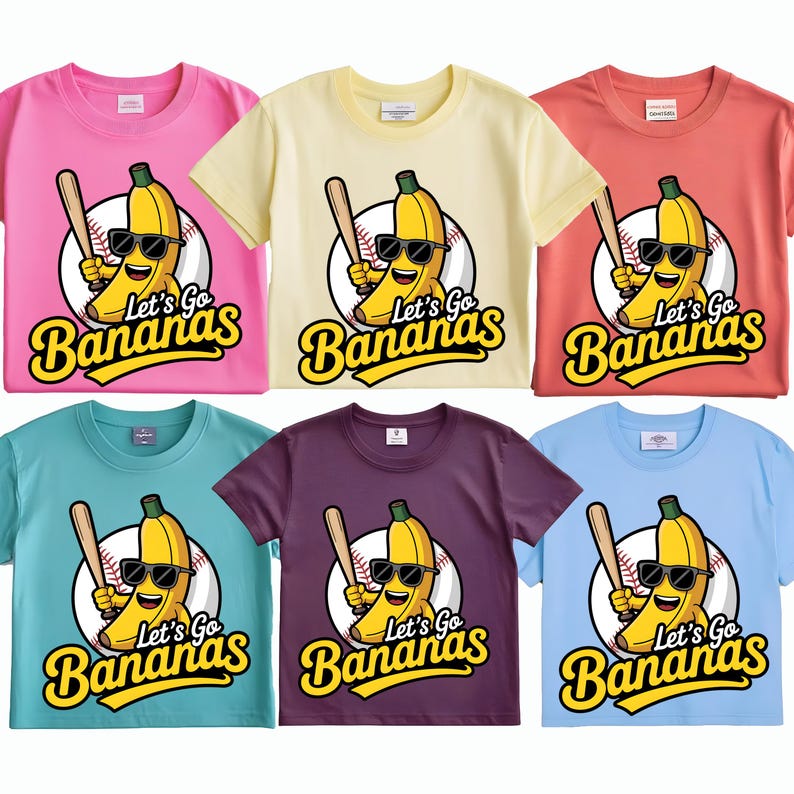 May include: Six colorful t-shirts with a cartoon banana wearing sunglasses and holding a baseball bat. The shirts are pink, yellow, coral, teal, purple, and light blue. Each shirt has the text "Let's Go Bananas" in yellow.