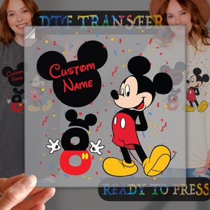 May include: A ready-to-press iron-on transfer featuring Mickey Mouse with confetti and the text "Custom Name".