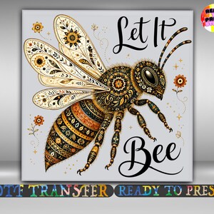May include: A square graphic print featuring a stylized bee with intricate gold, black, and orange floral patterns on its wings and body. The text Let It Bee is written in black script. Small orange flowers and gold stars surround the central bee.