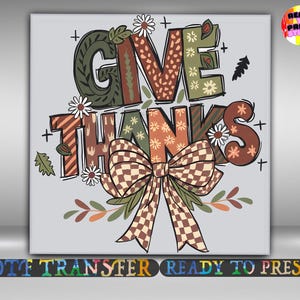 May include: A graphic design with the words "GIVE THANKS" in various patterns and colors, including brown, green, and orange. The design features a large bow, flowers, and leaves, perfect for Thanksgiving or fall-themed crafts.