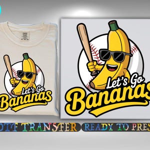 May include: A cream-coloured t-shirt and a canvas print featuring a cartoon banana wearing sunglasses and holding a baseball bat. The text "Let's Go Bananas" is in yellow script. The image is a DTF transfer.