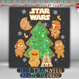 May include: A dark gray graphic print featuring the text STAR WARS in white and orange. The design includes a green Christmas tree cookie with colorful sprinkles, surrounded by gingerbread-style characters and a Death Star cookie with snowflakes.