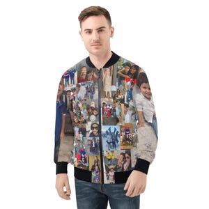 May include: A black bomber jacket featuring a collage of photographs. The jacket has a black collar, cuffs, and hem. The photographs are of various sizes and depict people and scenes. The jacket is worn by a person in blue jeans.
