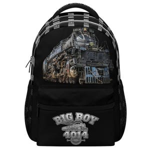 May include: A black backpack featuring a detailed graphic of a steam locomotive on the front. The design includes the text BIG BOY 4014 with a small train illustration below it. The bag has a top handle, side mesh pockets, and zipper closures.