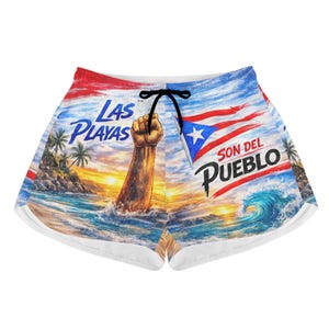 May include: Shorts with a vibrant beach scene design. The shorts feature a fist rising from the ocean, a Puerto Rican flag, and the words "Las Playas" and "Son Del Pueblo." The design includes palm trees, waves, and a sunset.