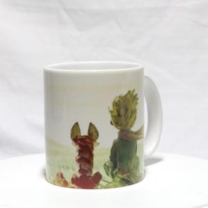 May include: A set of three ceramic mugs with a speckled, matte finish. The mugs are in shades of cream, light gray, and dark gray. Each mug has a simple, minimalist design, perfect for coffee or tea.