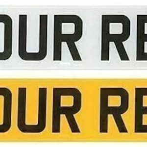 May include: Two number plates, one white and one yellow, both with the text "YOUR REG" in black letters.