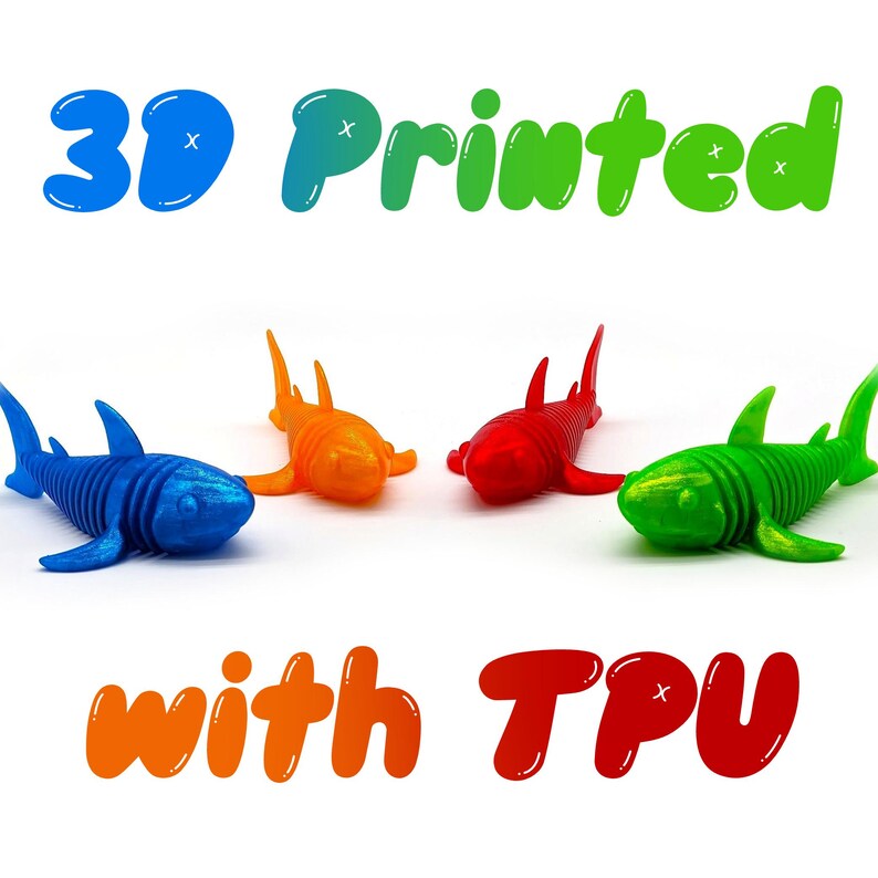 May include: Four 3D-printed shark toys in blue, orange, red, and green. The text "3D Printed with TPU" is displayed above and below the sharks. The sharks are lying down on a white surface.