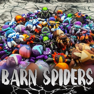 May include: A collection of colorful, hand-painted barn spider figurines. The spiders are made of polymer clay and have various colors, patterns, and textures.