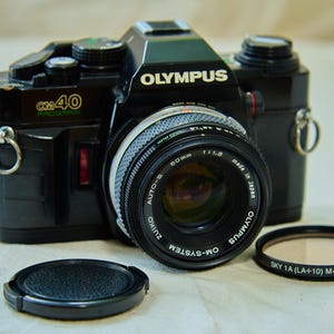 Olympus OM40 35 mm Filmkamera, mit Olympus OM Zuiko 50 mm f1,8 Objektiv