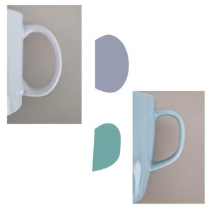 May include: Two ceramic mugs shown in partial view. The left mug is white with a curved handle. The right mug is a light blue color with a matching curved handle. Between the two mugs are two abstract shapes, one in a muted purple and one in teal.