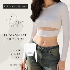 Könnte beinhalten: Ein weißes langärmliges Crop-Top mit Ausschnitt, kombiniert mit einer blauen Jeans. Das Bild enthält Text: "PDF Sewing Pattern", "Daisy Pattern", "Long-Sleeve Crop Top" und Größenangaben in US- und EU-Größen. Das Muster ist für Anfänger.