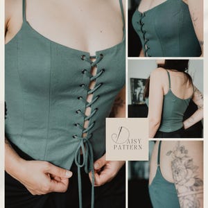 May include: A sage green corset-style top featuring thin spaghetti straps, a square neckline, and a front lace-up closure with dark metal grommets and matching fabric ties. The text Daisy Pattern is displayed in a square box on the image.