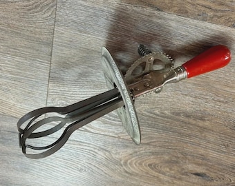 Vintage hand crank beater with red handle