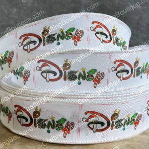 May include: White ribbon with a repeating pattern of the Disney logo and Christmas-themed elements, including candy canes, holly, and Santa hats.