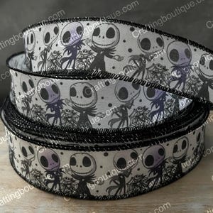 May include: Black and white ribbon with a repeating pattern of Jack Skellington from The Nightmare Before Christmas. The ribbon has a black edge.