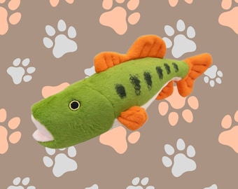 May include: A green and orange plush fish toy with a realistic design. The fish has a wide open mouth and a black eye. The toy is perfect for dogs to play with and chew on.
