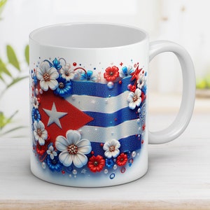 May include: White ceramic mug with a colorful design featuring the Cuban flag surrounded by flowers and stars.