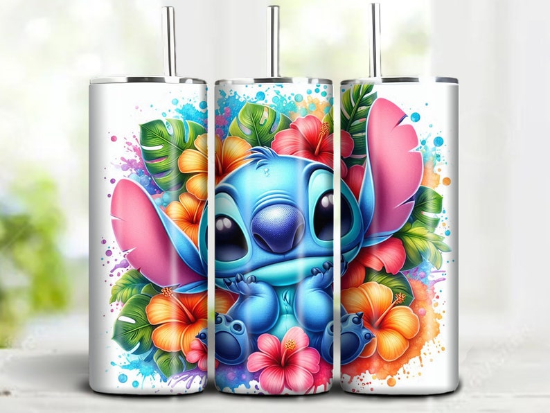 May include: A white tumbler featuring a blue cartoon character with large ears, surrounded by colorful flowers and tropical leaves. The design includes pink, orange, and red hibiscus flowers, with a splash of watercolor effects.