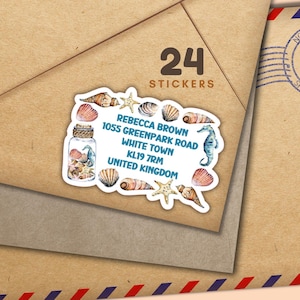 May include: A white sticker with a seashell border and a blue and white address label. The address reads: Rebecca Brown, 1055 Greenpark Road, White Town, KL19 7RM, United Kingdom. The sticker says "24 Stickers" at the top.