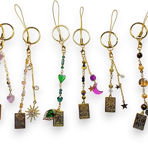 Sleutelhanger/telefoonbedel - gouden tarotkaarten: The Lovers, The Sun, The World, La Luna, The Stars en La Fortuna