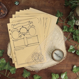 May include: A stack of tan paper character sheets for a tabletop role-playing game, featuring printed black ink borders, text labels like Population, Terrain, and Rating, and circular and rectangular fields for notes, with a clear plastic stencil overlay.