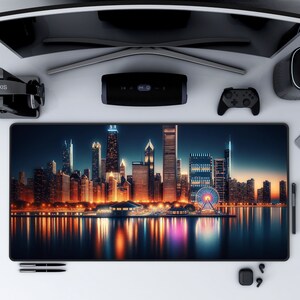 May include: A black mousepad with a cityscape at night. The city skyline is reflected in the water below. The city is lit up with lights. A Ferris wheel is visible in the distance.