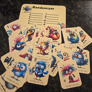 May include: A set of colorful cards with cartoon birds and numbers. Each card has the text "Savings with Traci" and a number from 1 to 8. The cards are arranged in a random order on a brown surface.