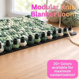 May include: A modular knit blanket loom with black pegs arranged on a flat base. The loom features a partially completed green and cream textured knit project. Text on the image reads: Modular Knit Blanket Loom and 20+ Colors available for maximum custamization!
