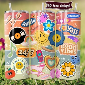 May include: Three stainless steel tumblers with colorful retro-style designs. The designs include a record, a rainbow, a smiley face, a flower, a heart, a UFO, a phone, a dog, a star, a flower, and the words "Smile", "24/7", "Good Times", "Good Vibes", "Yass", "Awesome!" and "Wassup."