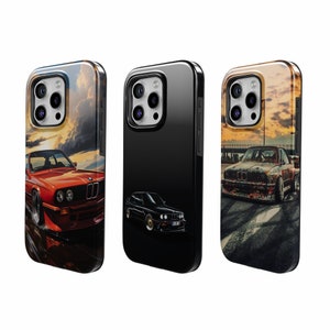 May include: Three phone cases with different designs. The first case features a red car with a sunset background. The second case is black with a black car. The third case features a rusty car with a sunset background.