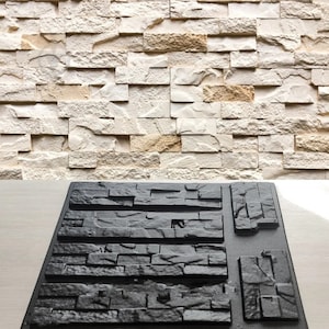 May include: A black plastic mold for creating a faux stone wall. The mold has multiple sections that create different sized and shaped stones.