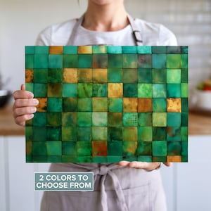 May include: A rectangular decorative panel with a mosaic design. The panel features a grid of square tiles in shades of green, gold, and brown. The text "2 COLORS TO CHOOSE FROM" is displayed at the bottom of the panel.