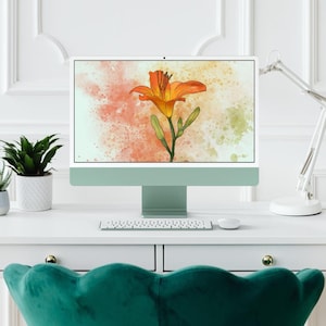 May include: A desktop computer with a light green case and a white keyboard. The computer screen displays a digital illustration of an orange lily flower on a watercolor background.
