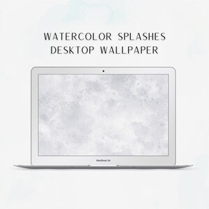 May include: A laptop computer with a white background featuring a watercolor splatter design. The laptop screen displays the text "WATERCOLOR SPLASHES DESKTOP WALLPAPER".