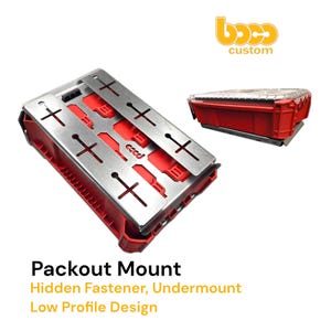 May include: A red Packout Mount with a silver metal top featuring cross-shaped cutouts. The text "Packout Mount" is visible, along with "Hidden Fastener, Undermount, Low Profile Design."