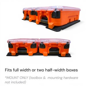 May include: A black mounting plate designed to hold two orange and clear plastic toolboxes. The text reads: Fits full width or two half-width boxes. *MOUNT ONLY (toolbox & mounting hardware not included). The plate features a flat base.