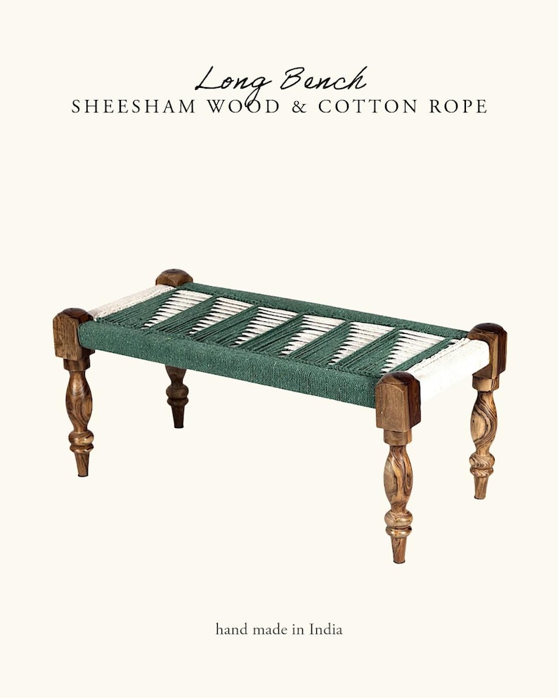 May include: A long bench made of sheesham wood and cotton rope. The bench has a woven seat in green and white, supported by four carved wooden legs. The text "Long Bench" and "hand made in India" are visible.