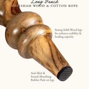 May include: Close-up of a wooden bench leg made of sheesham wood and cotton rope. The leg has a rounded design with a dark rubber pad on the bottom. Text on the image reads "Long Bench" and "Anti-Skid & Sound-Absorbing Rubber Pads on legs."