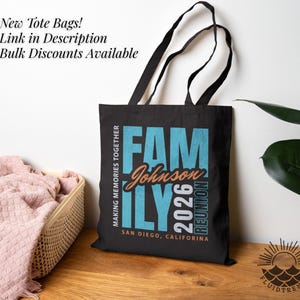 May include: Black tote bag featuring the text "FAM Johnson ILY 2026 REUNION" in teal and orange. The bag also displays "MAKING MEMORIES TOGETHER" and "SAN DIEGO, CALIFORNIA". It has black handles and the text "New Tote Bags! Link in Description Bulk Discounts Available".