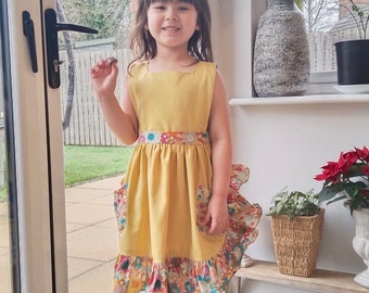 Patrón de vestido de niña: estilo delantal, tallas 3-9 (Descargar PDF)